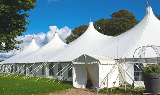 a line of sleek and modern porta potties ready for use at an upscale corporate event in Hypoluxo